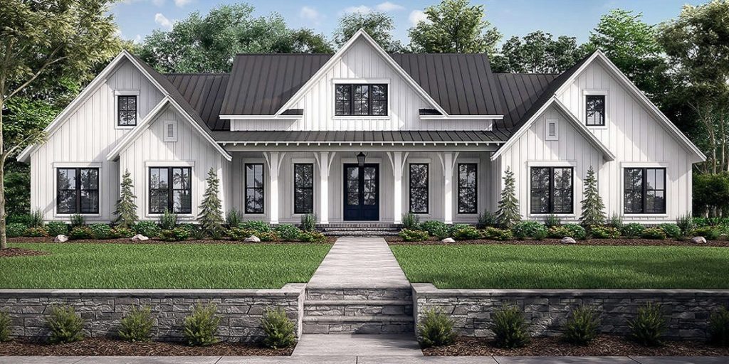 Two story modern farmhouse style custom home built by Mikkelson builders.  Features white siding and slate grey roof.